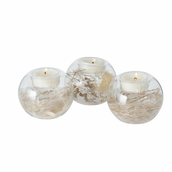 Bougeoir boule en verre avec fleurs séchées à l'intérieur