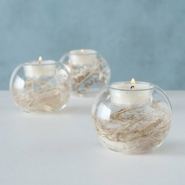 Bougeoir boule en verre avec fleurs séchées à l'intérieur