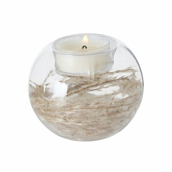 Bougeoir boule en verre avec fleurs séchées à l'intérieur